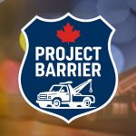 Yellow caution light in the street at night - Hamilton Police Project Barrier - Illegal Towing.